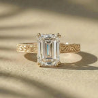 Front view of a 3 ct emerald cut lab grown diamond ring with detailed filigree scrollwork on band