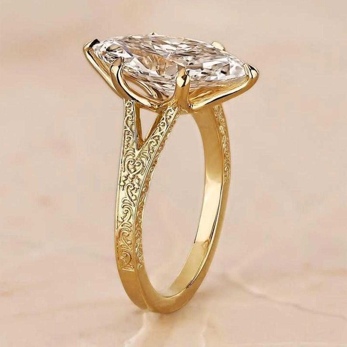 Close-up side profile of yellow gold cathedral engagement ring showing detailed scrollwork engraving