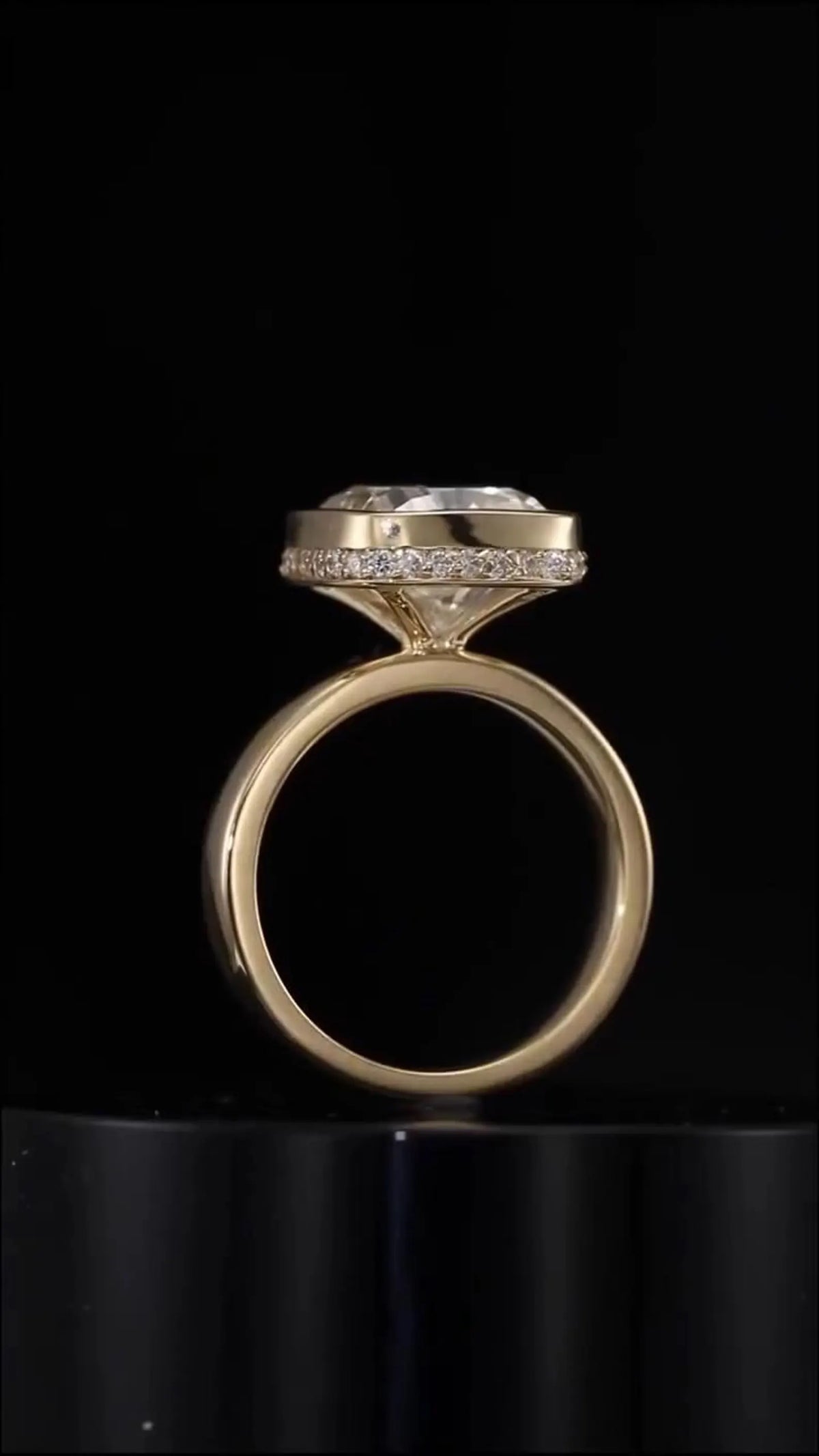 Full side profile of 3 ct cushion lab grown diamond ring displaying polished gold band and hidden halo