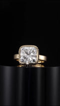 Front view showcasing 3 carat cushion cut lab grown diamond set in smooth yellow gold bezel
