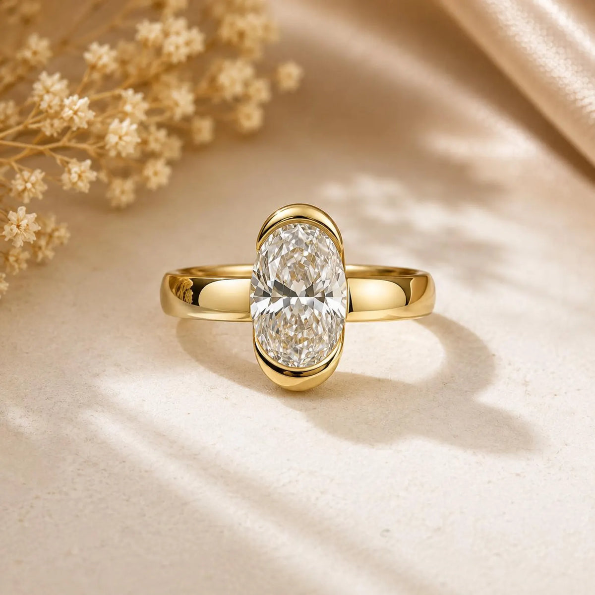 Front view of 2 CT oval cut lab grown diamond set in smooth yellow gold bezel setting