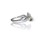 Angle profile of a 3 carat round lab grown diamond halo engagement ring with pavé accent stones