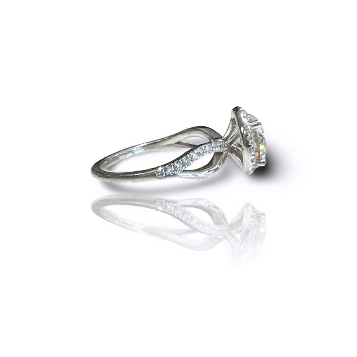 Angle profile of a 3 carat round lab grown diamond halo engagement ring with pavé accent stones