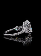 Side profile view highlighting heart-shaped side accent stones and pave band on a lab grown diamond ring