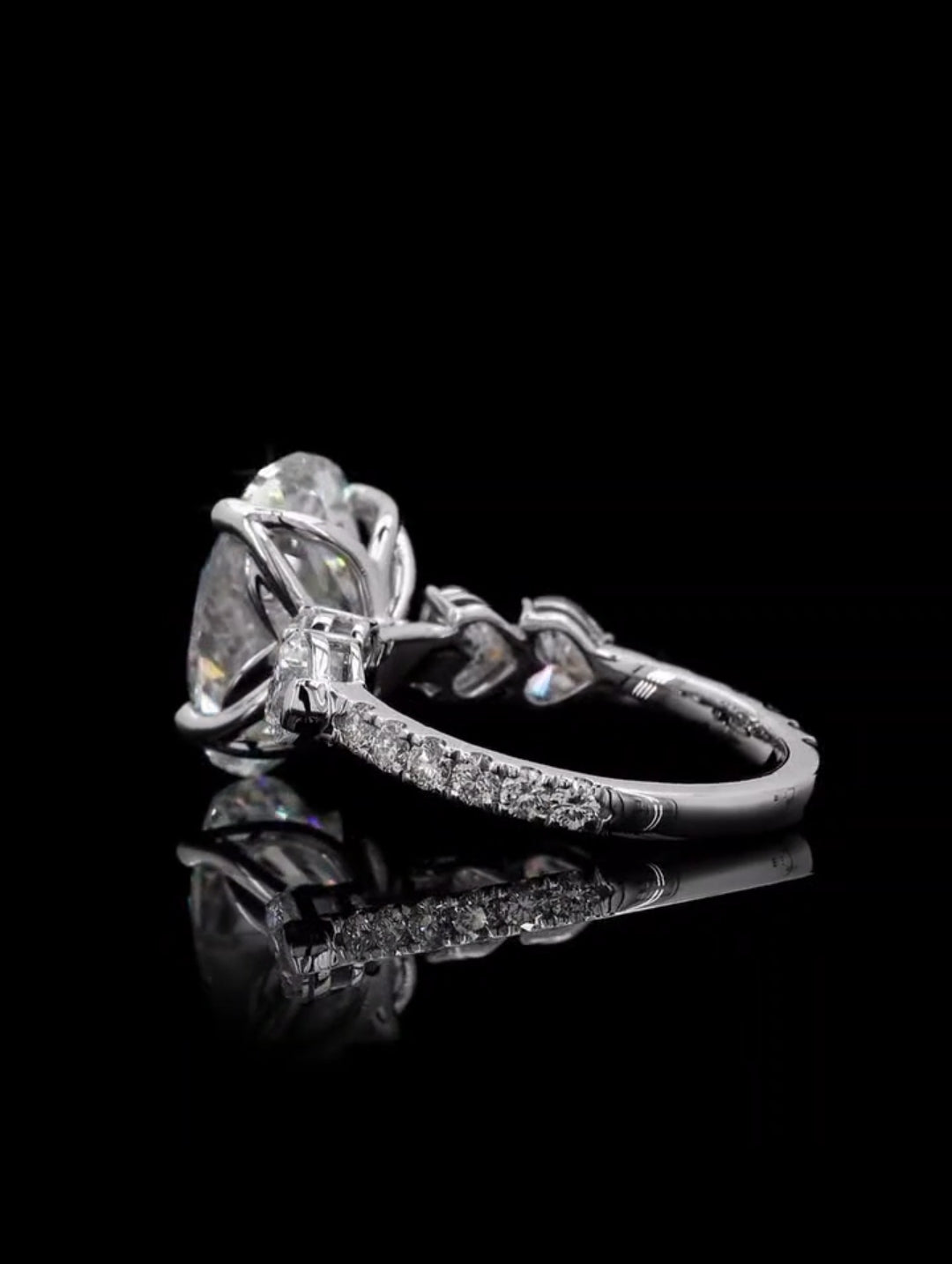 Profile view showcasing the tulip basket and micro-pave diamond band on a white gold engagement ring
