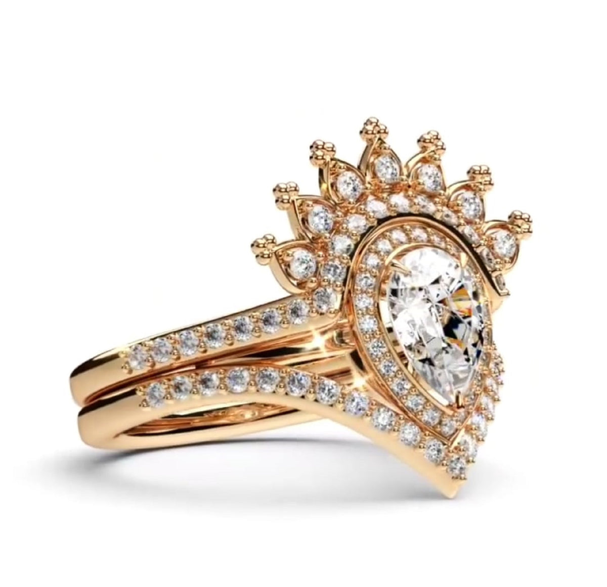 A rose gold wedding ring set featuring a pear-cut center stone and multiple small round diamonds, with a crown-like halo and matching split shank band, shown on a white background.