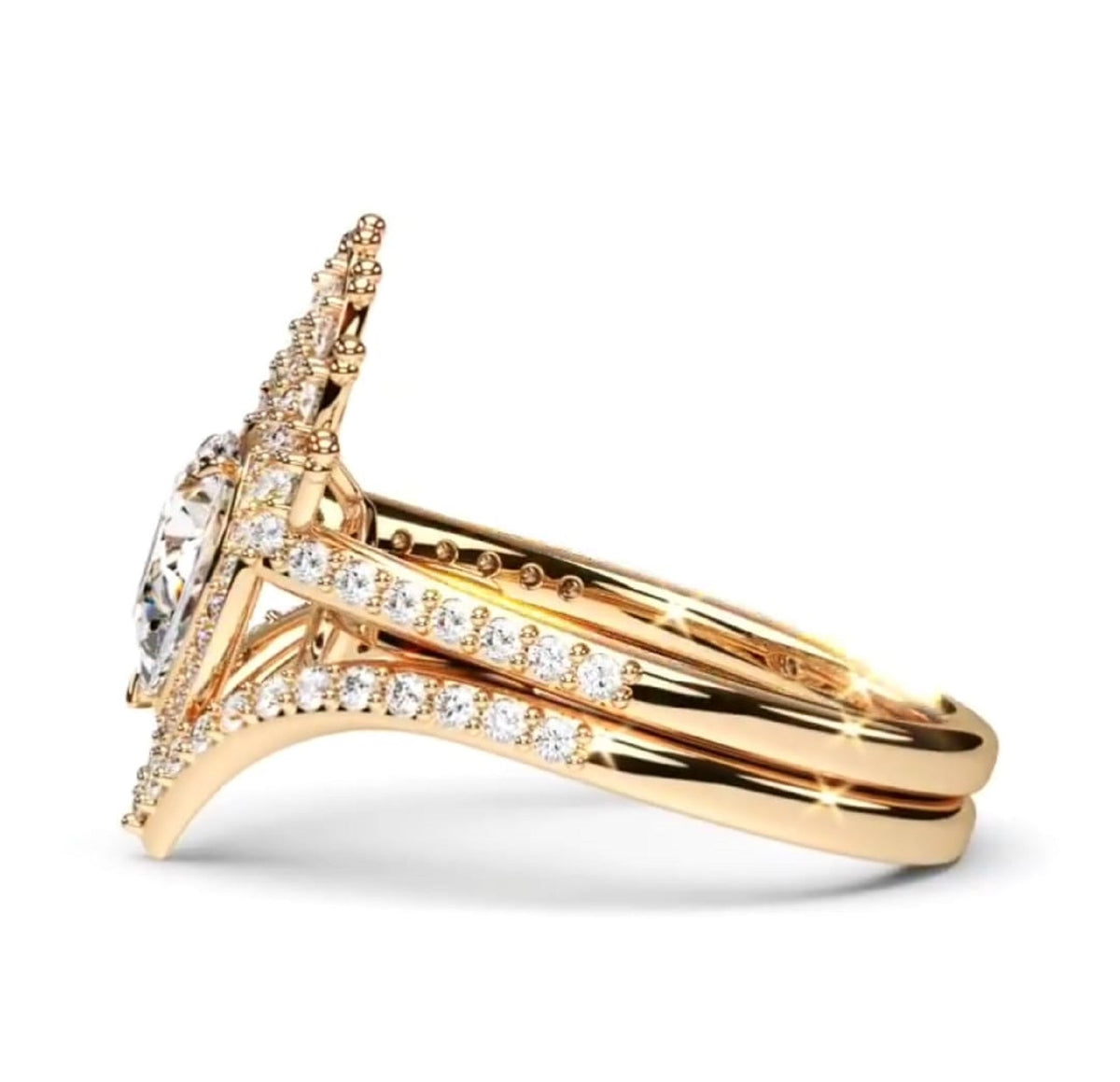Right angle view showing side details of yellow gold 2ct pear diamond halo ring stacked with tiara crown band