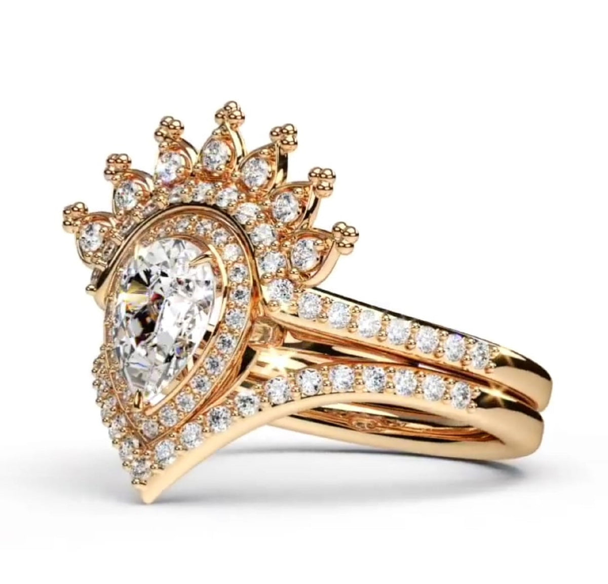 Perspective view showing sparkling teardrop center stone and crown band on yellow gold pear diamond ring set