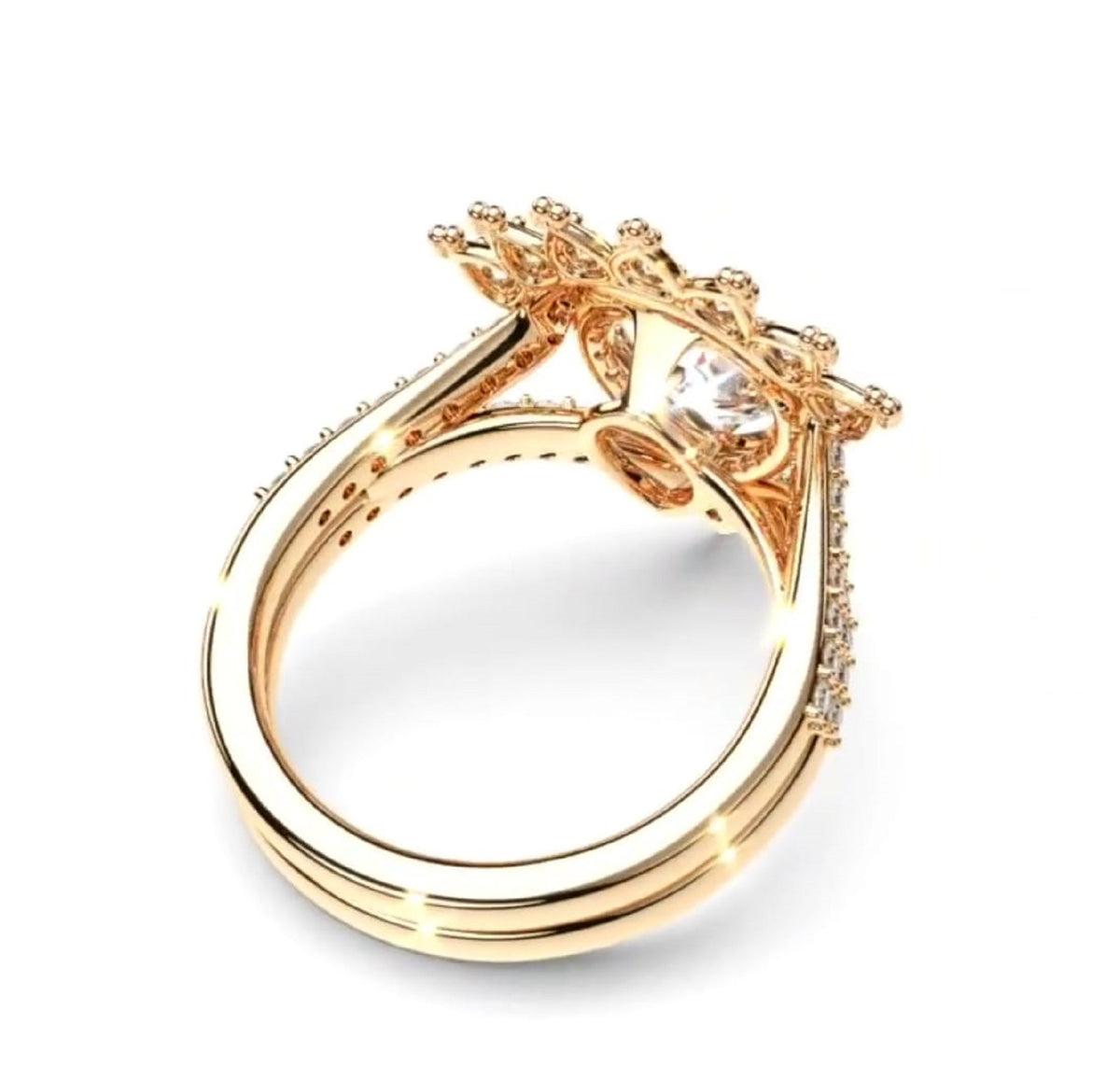 Bottom under-angle view displaying setting construction and band alignment for 2ct pear diamond ring set