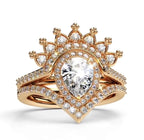 Close-up front view of yellow gold 2 carat pear lab grown diamond ring with crown tiara jacket and chevron band