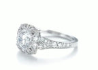Angle view highlighting scalloped floral halo and pave band details on 2 carat round lab diamond ring