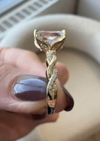 Close-up side profile of yellow gold twisted vine band with pave lab diamonds