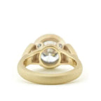 Under-gallery view showing the satin yellow gold band structure of 4 CT round bezel ring.