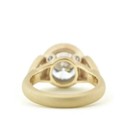 Under-gallery view showing the satin yellow gold band structure of 4 CT round bezel ring.