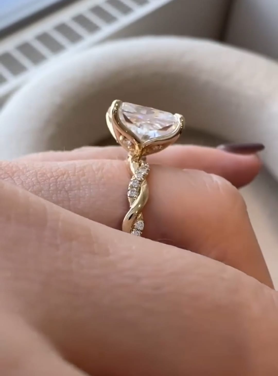 Side profile view of a 3 ct radiant cut diamond ring showing twisted shank detailing