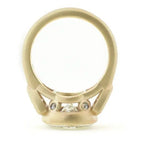 Profile view of 4 CT round diamond ring displaying peek-a-boo accent diamonds in gallery.