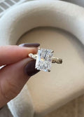 Top-down macro view of a 3 carat brilliant radiant cut lab diamond held between fingers