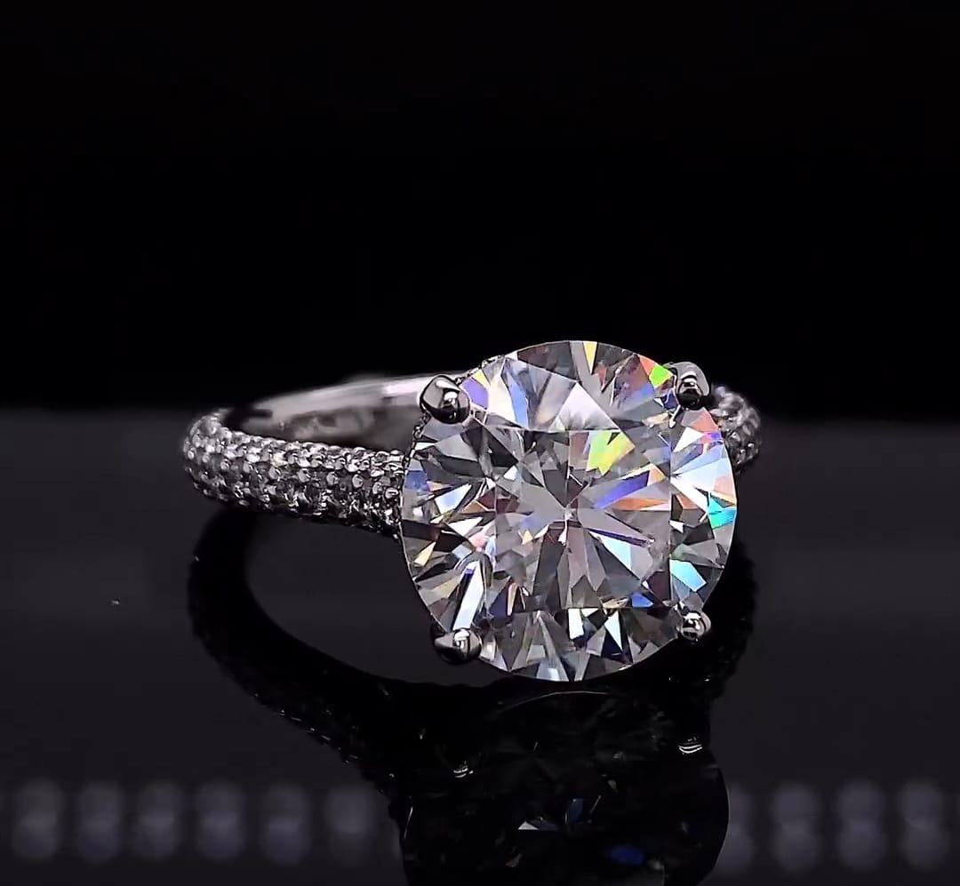 Top view showing fire and sparkle of a 4 carat round cut lab diamond engagement ring