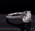 Angle view of 4ct round diamond ring highlighting the hidden halo basket setting