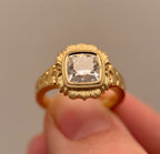 Front perspective of 4 CT cushion cut lab grown diamond in floral scalloped bezel halo frame.