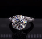 Front view of a 4 carat round brilliant lab diamond ring set on a pave band