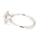 Side profile view of a 2 carat round lab grown diamond engagement ring with halo setting
