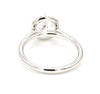 Underside view of white gold 2ct round lab diamond ring showing open cathedral gallery
