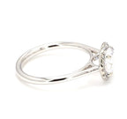Side angle view showing polished solid plain band and diamond halo head profile