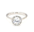 Top-down view of a 2 carat round cut lab grown diamond engagement ring with halo