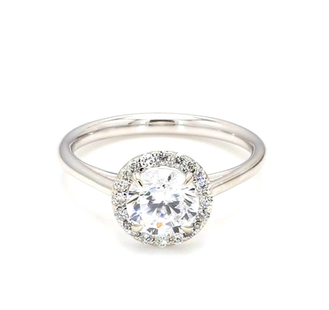 Top-down view of a 2 carat round cut lab grown diamond engagement ring with halo