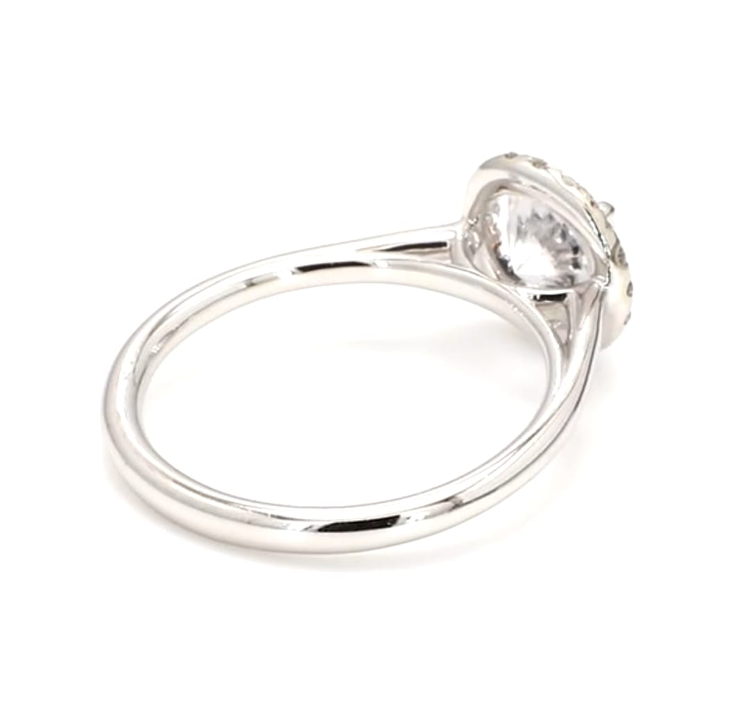 Perspective view of a white gold 2 ct round lab diamond halo engagement ring