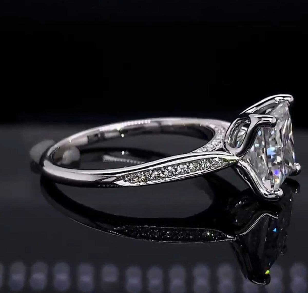 Side profile view highlighting the cathedral setting and pave shank of 3ct diamond ring