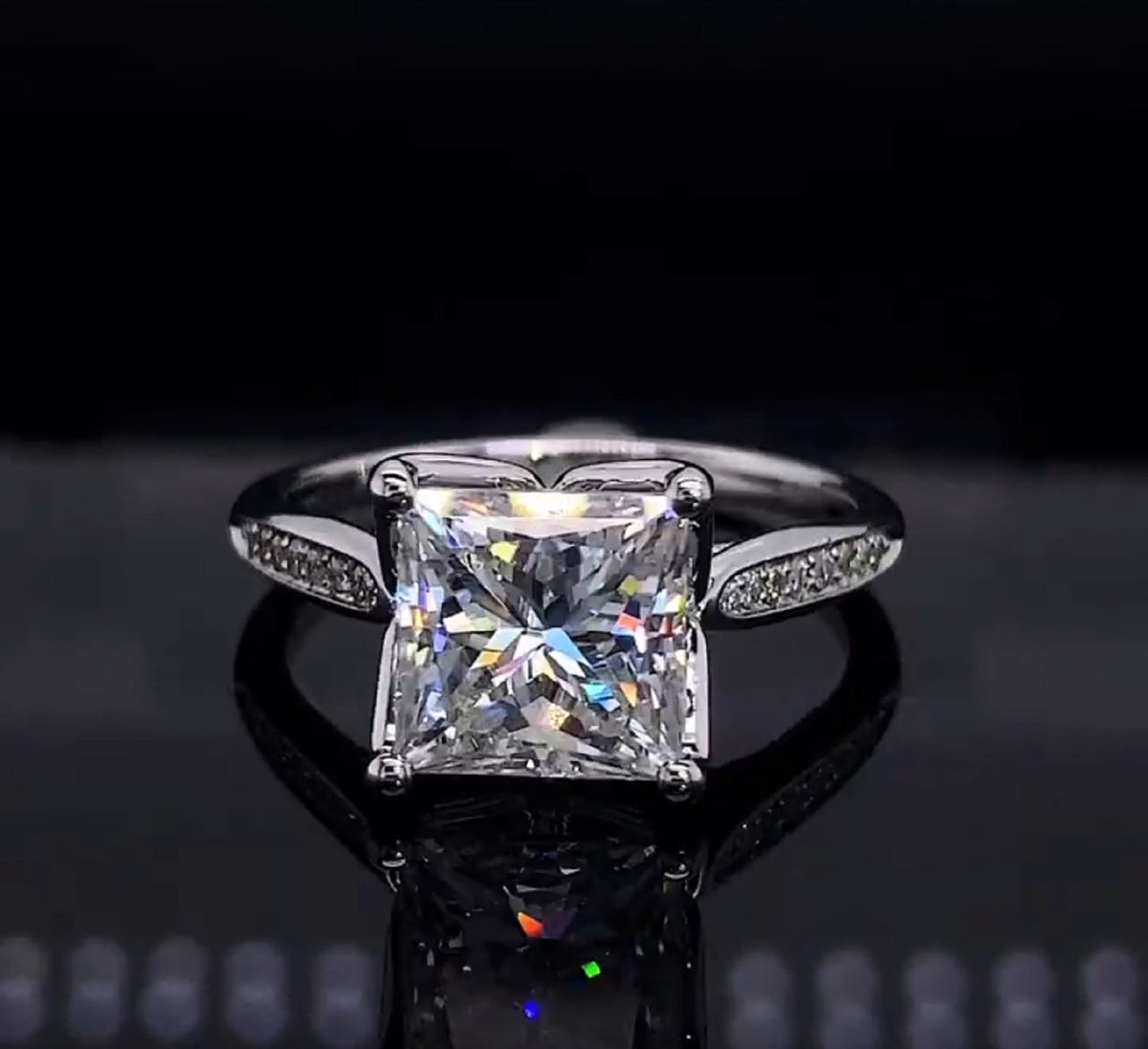 Straight-on view of 3ct princess cut diamond showing geometric clarity and brilliance