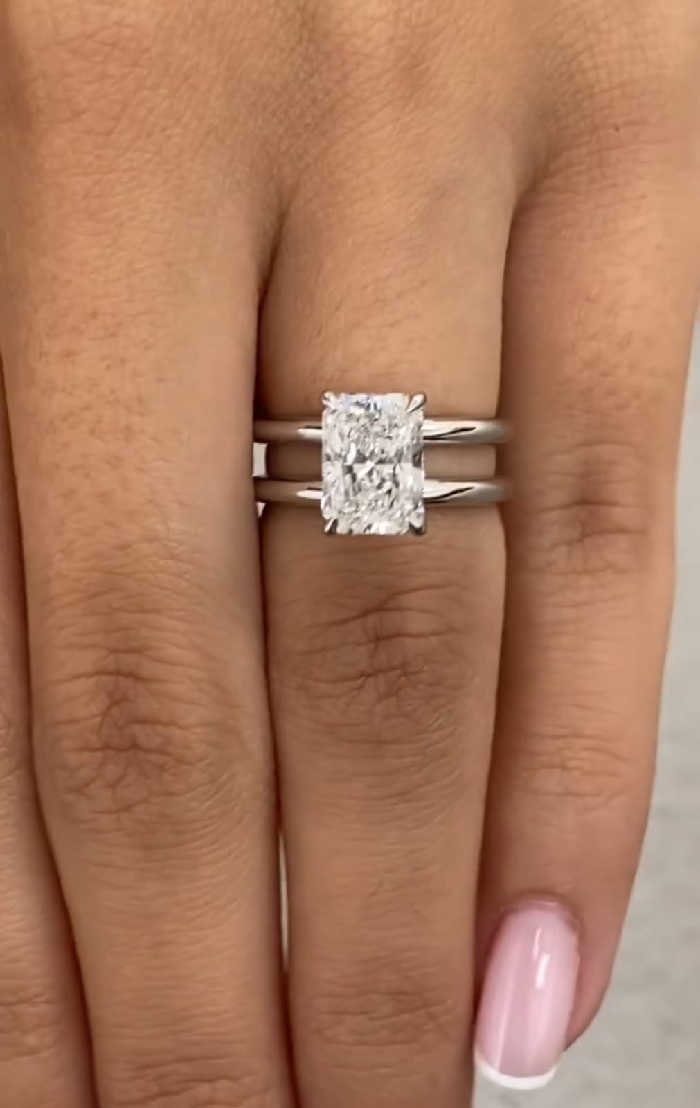 On-hand view of 2 carat radiant cut lab diamond double band engagement ring
