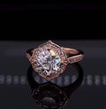 Front view of 3 CT round cut lab grown diamond engagement ring with scalloped floral halo in rose gold