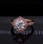 Front view of 3 CT round cut lab grown diamond engagement ring with scalloped floral halo in rose gold