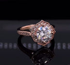 Angled top view of 3 carat round lab diamond ring with vintage rose gold floral halo setting