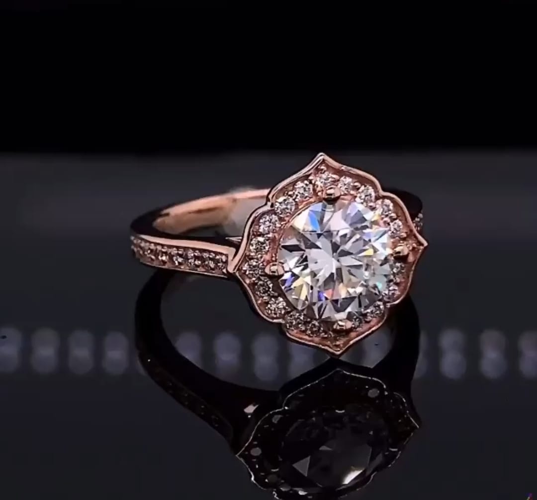 Angled top view of 3 carat round lab diamond ring with vintage rose gold floral halo setting