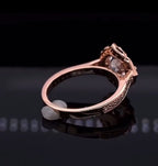 Back profile view showing the polished shank and setting detail of rose gold engagement ring