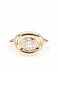 Top view of 2 CT east-west oval cut lab grown diamond ring in yellow gold chunky bezel setting