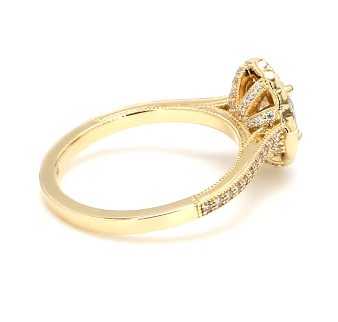 Angled side view of vintage scalloped halo diamond ring with milgrain-detailed pave band