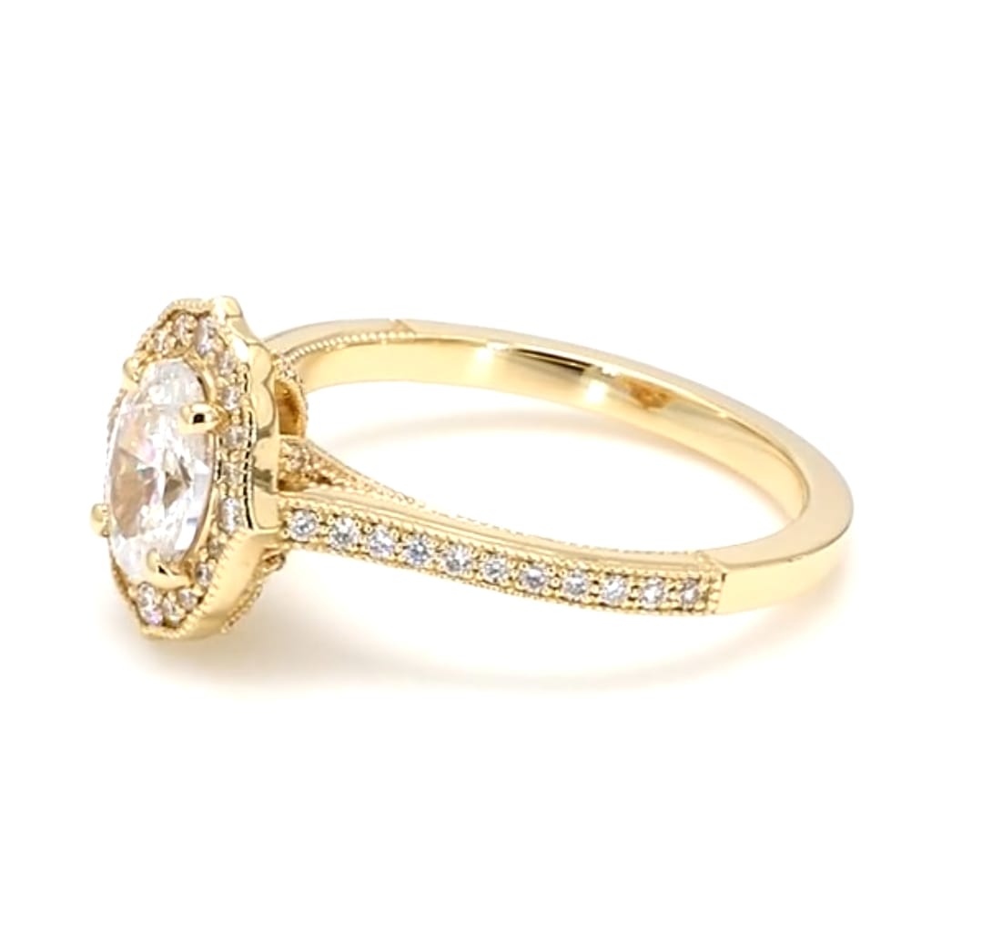 Close-up side profile of 2 carat oval diamond ring showing scalloped halo and basket setting