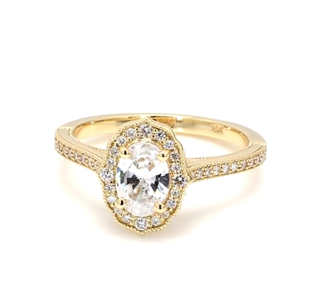 Front view of 2 CT oval cut lab diamond ring with yellow gold scalloped halo and pave band
