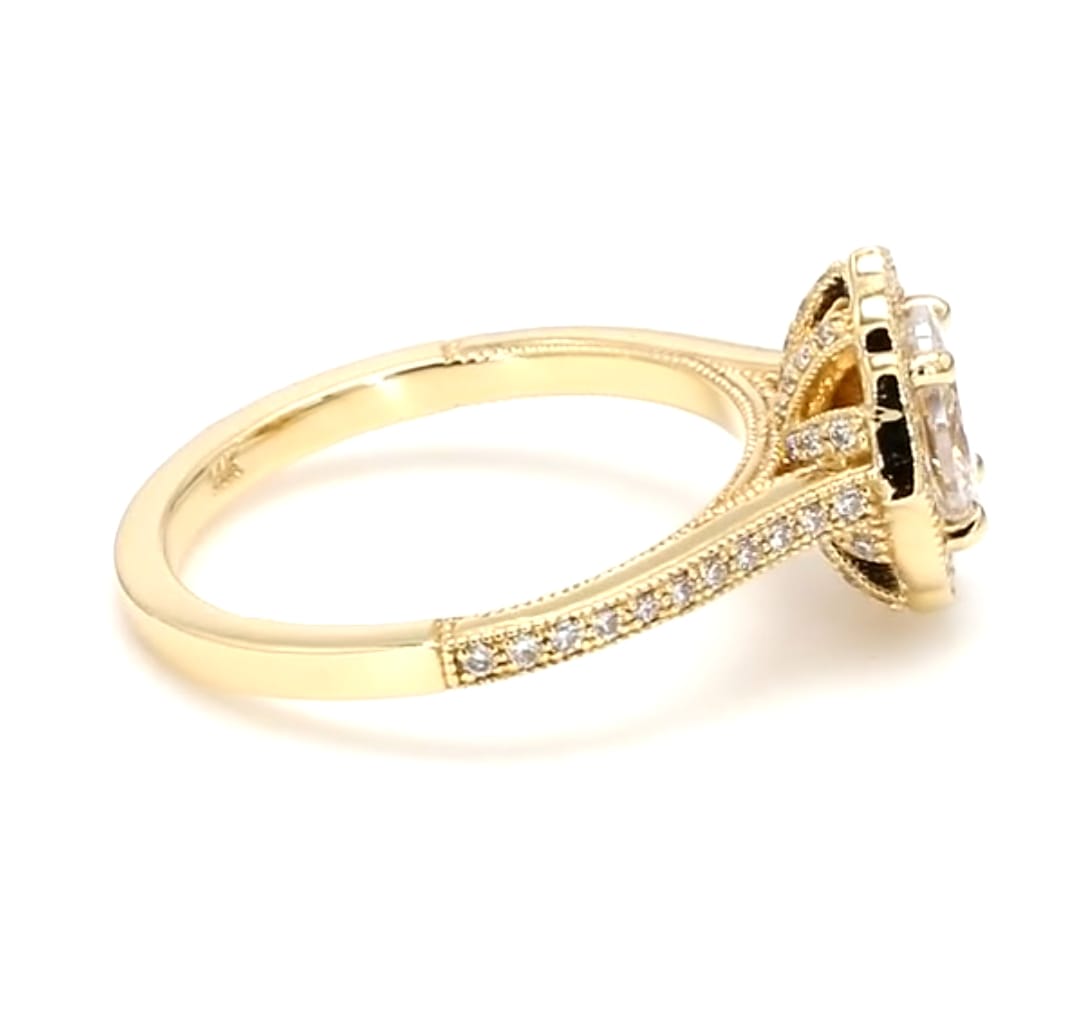 Profile view showing intricate diamond gallery basket and polished yellow gold lower shank
