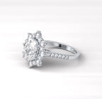 Angled side view of a 2 CT oval lab grown diamond ring with a starburst halo and diamond pavé band.
