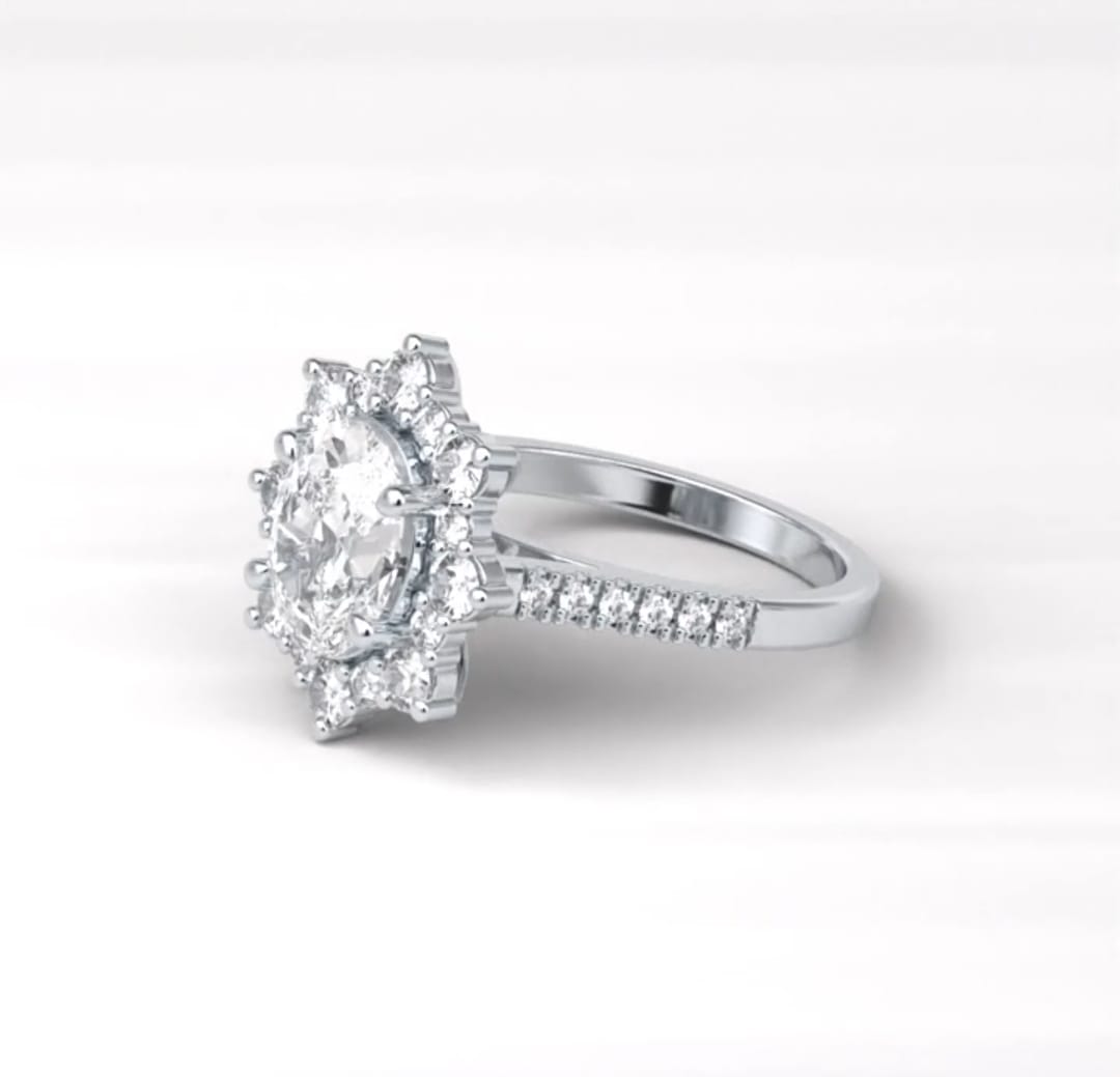 Angled side view of a 2 CT oval lab grown diamond ring with a starburst halo and diamond pavé band.