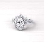 Top-down view of a 2 carat oval cut vintage halo diamond engagement ring showing the full sunburst design.
