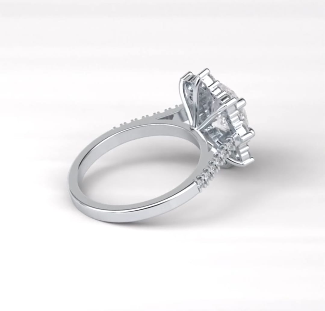 Back profile view highlighting the raised cathedral setting and pavé band of the starburst halo ring.