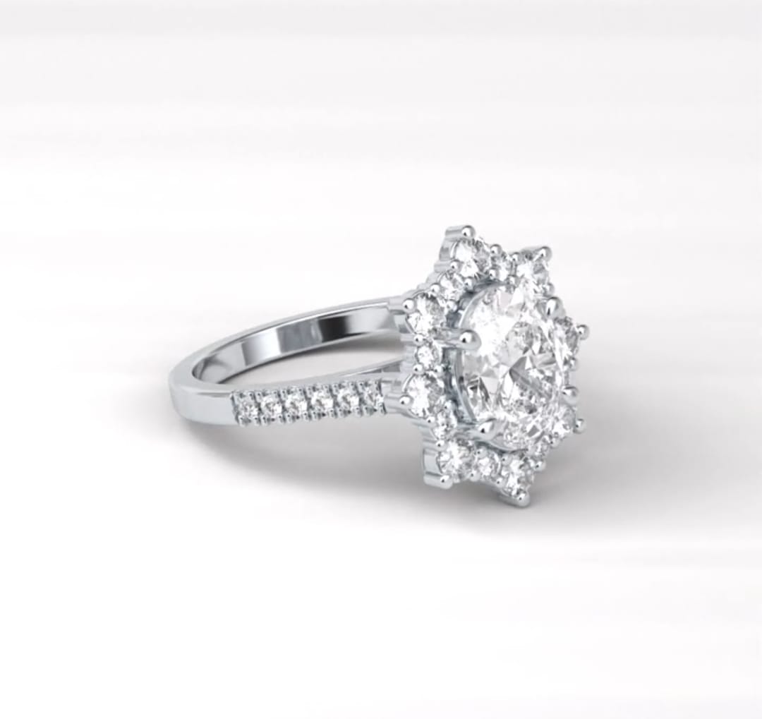 Angled top view of the 2 CT oval diamond ring emphasizing the brilliance of the center stone and halo.