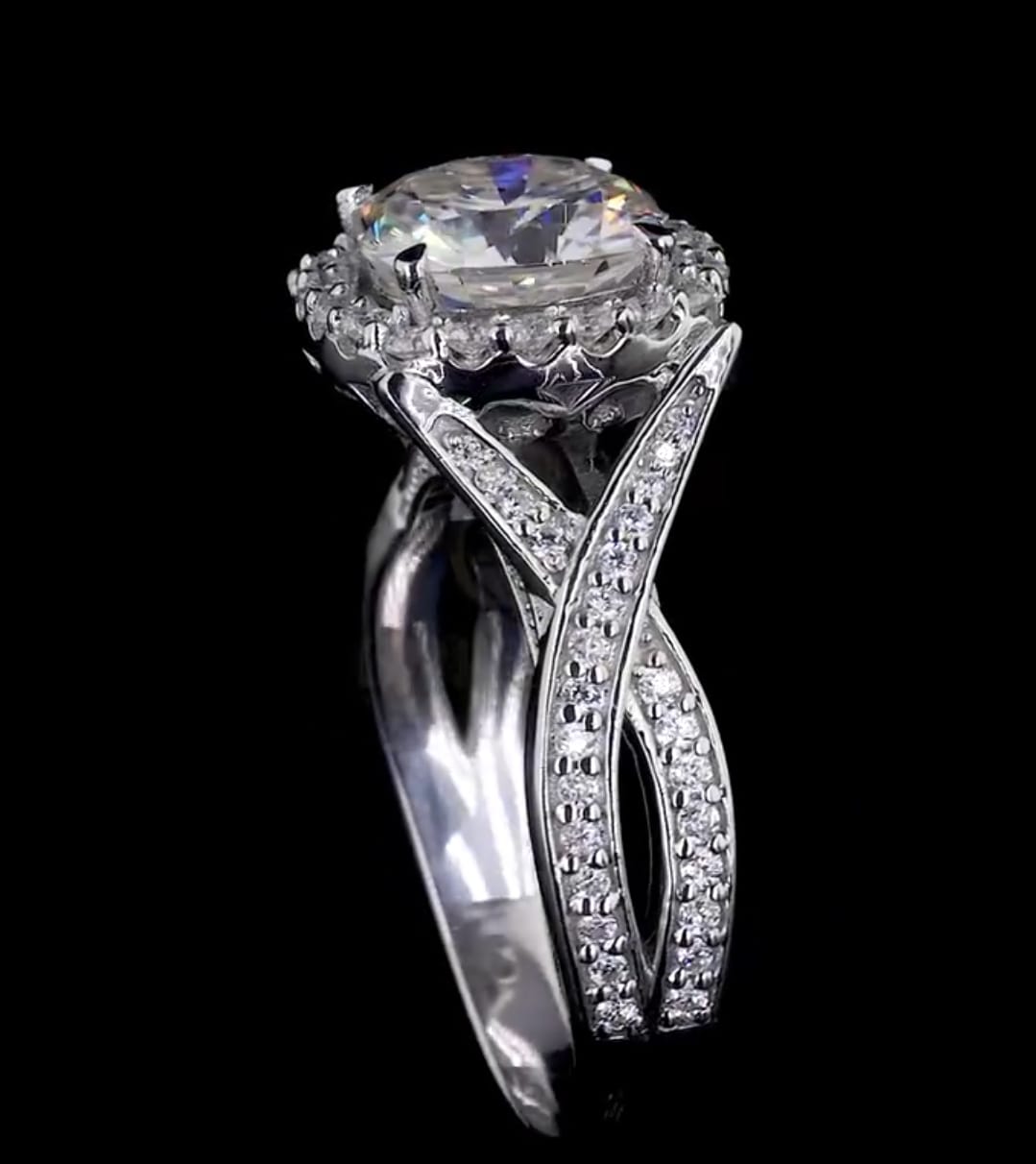High-angle side profile view showcasing the elevated halo setting and diamond-encrusted twisted band.